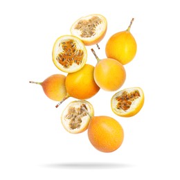 Image of Delicious ripe passion fruits falling on white background