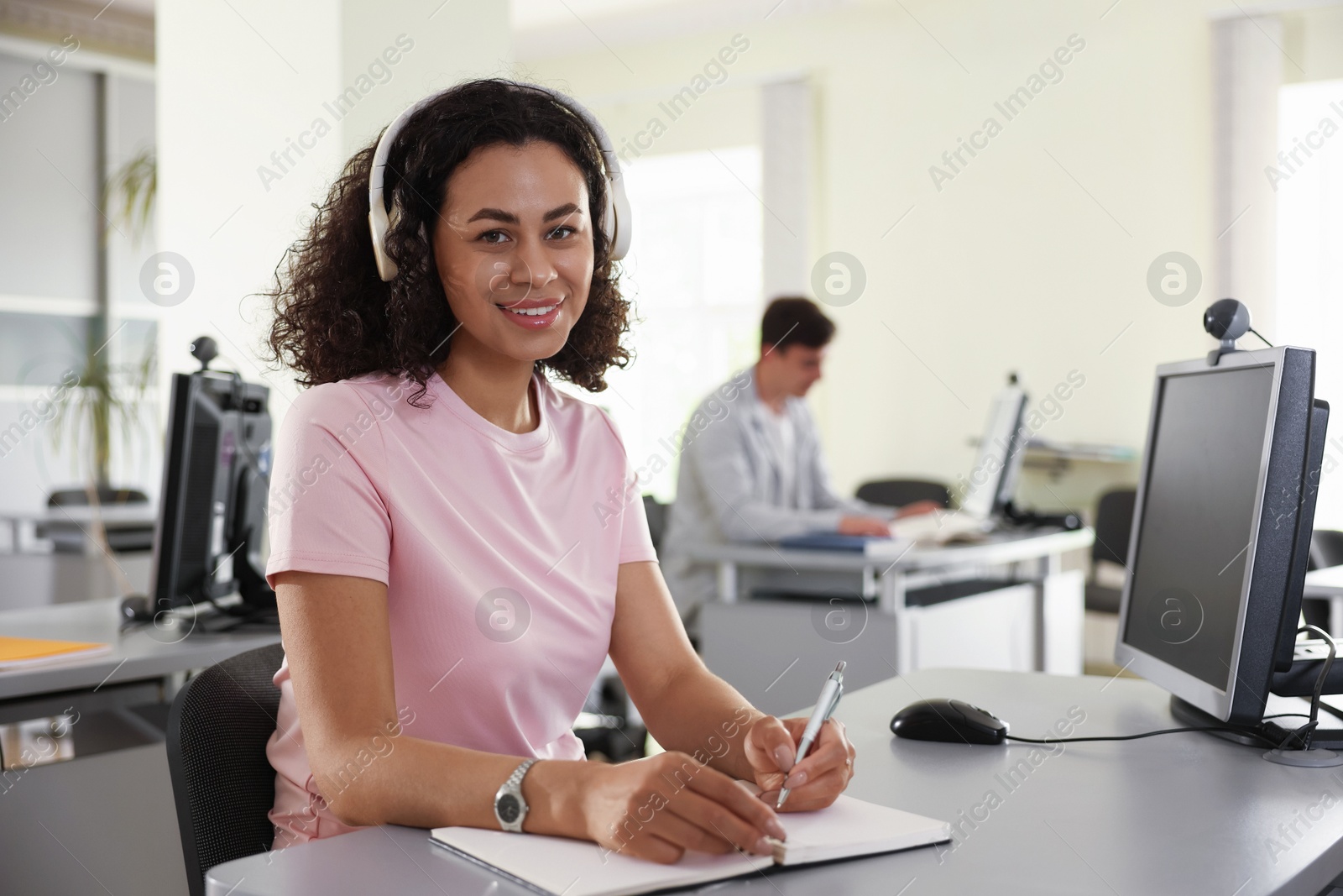 People working at desks in library, selective focus Photo of People working at desks in library, selective focus