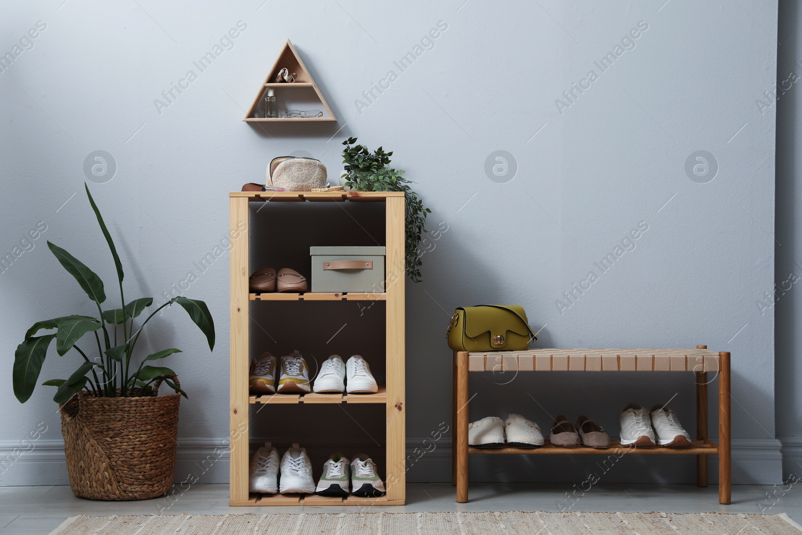 Different footwear on shelves in entryway. Shoe storage Photo of Different footwear on shelves in entryway. Shoe storage
