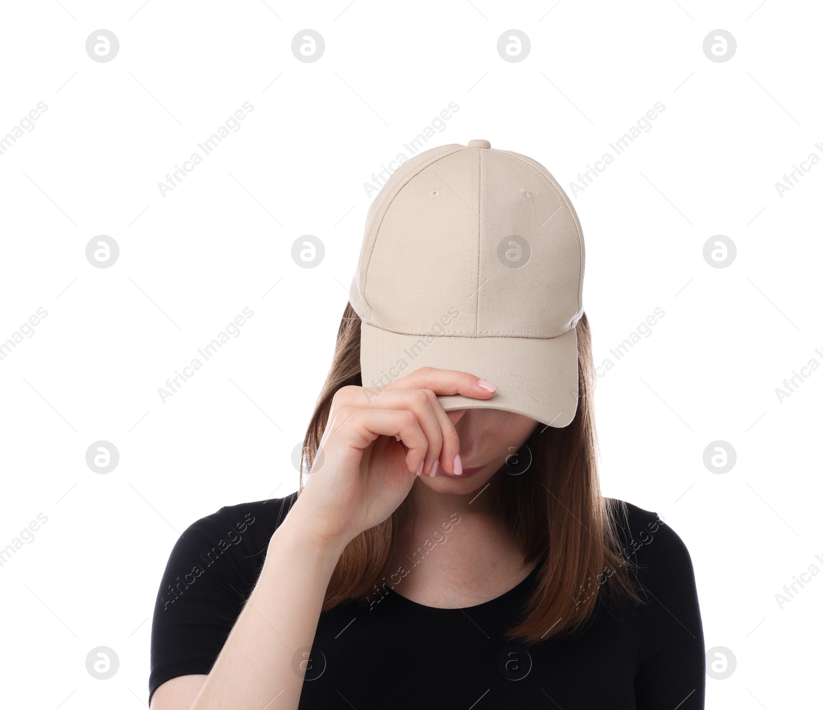 Young woman wearing stylish beige baseball hat on white background Photo of Young woman wearing stylish beige baseball hat on white background