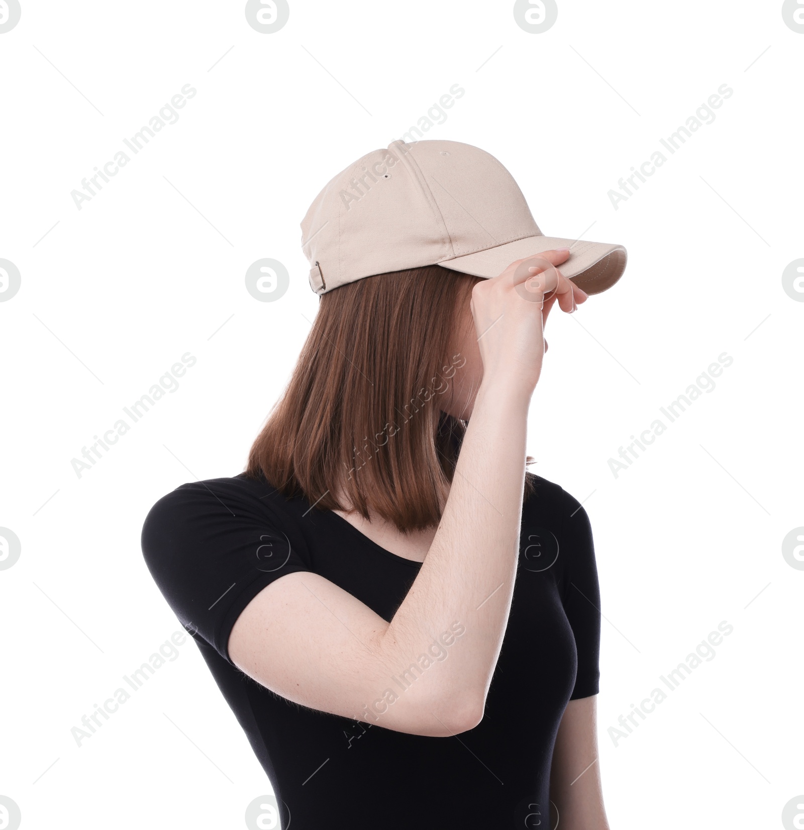 Young woman wearing stylish beige baseball hat on white background Photo of Young woman wearing stylish beige baseball hat on white background