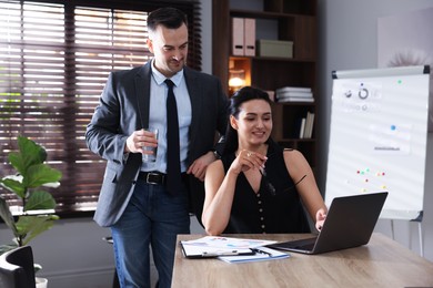 Photo of Marketing. Two colleagues working together in office