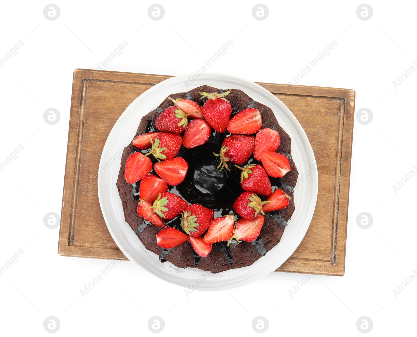 Delicious chocolate bundt cake with strawberries isolated on white, top view Photo of Delicious chocolate bundt cake with strawberries isolated on white, top view