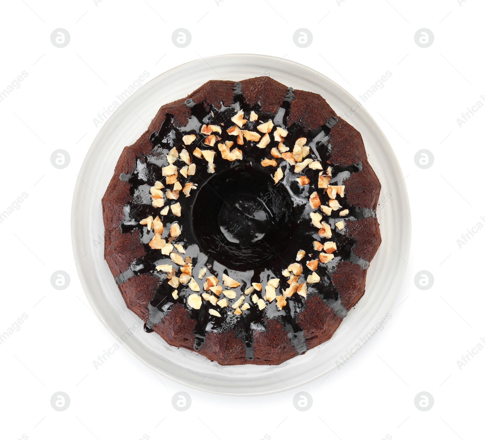 Delicious chocolate bundt cake with nuts isolated on white, top view Photo of Delicious chocolate bundt cake with nuts isolated on white, top view