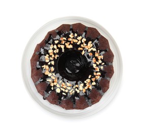 Photo of Delicious chocolate bundt cake with nuts isolated on white, top view