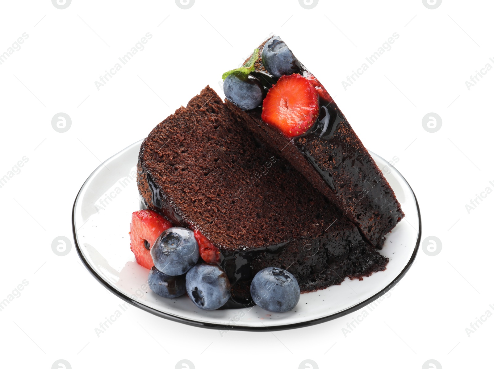 Pieces of delicious chocolate bundt cake with strawberries and blueberries isolated on white Photo of Pieces of delicious chocolate bundt cake with strawberries and blueberries isolated on white