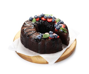 Photo of Delicious chocolate bundt cake with strawberries, mint and blueberries isolated on white
