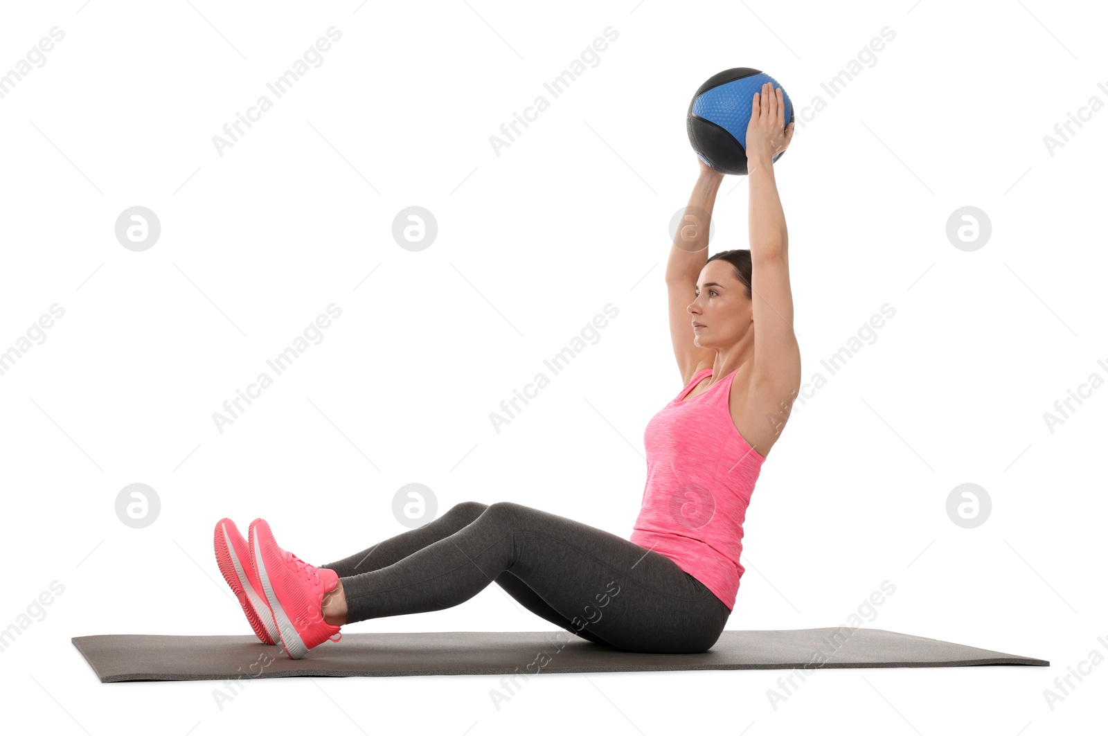 Athletic woman exercising with medicine ball on white background Photo of Athletic woman exercising with medicine ball on white background