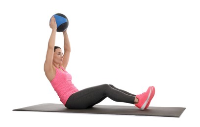 Photo of Athletic woman exercising with medicine ball on white background