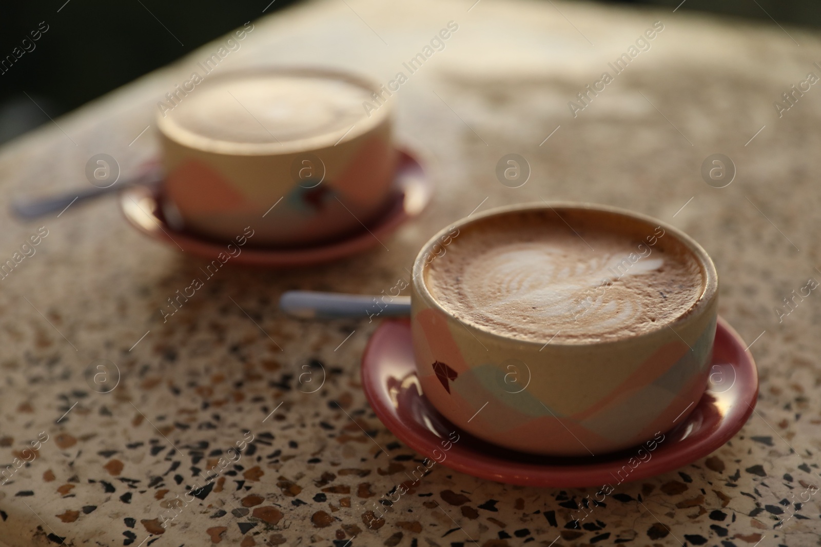 Aromatic coffee served on light table, closeup Photo of Aromatic coffee served on light table, closeup