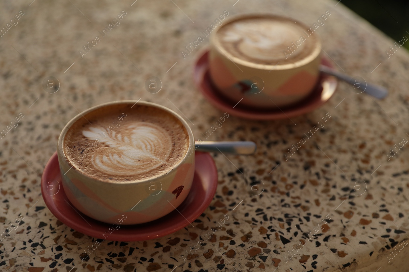 Aromatic coffee served on light table, closeup Photo of Aromatic coffee served on light table, closeup