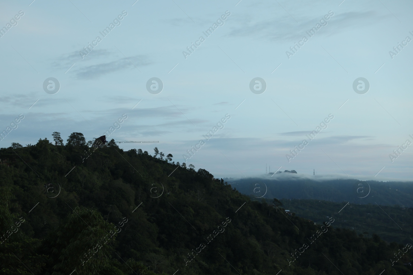 Picturesque view of mountains covered with fog Photo of Picturesque view of mountains covered with fog