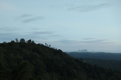 Photo of Picturesque view of mountains covered with fog