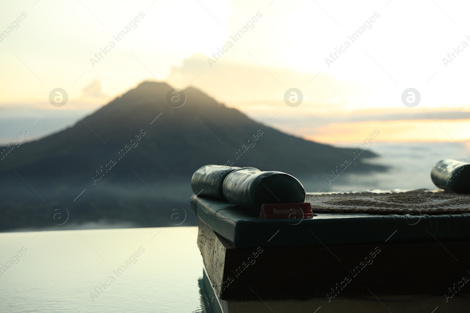 Empty couch with picturesque view of mountains Photo of Empty couch with picturesque view of mountains