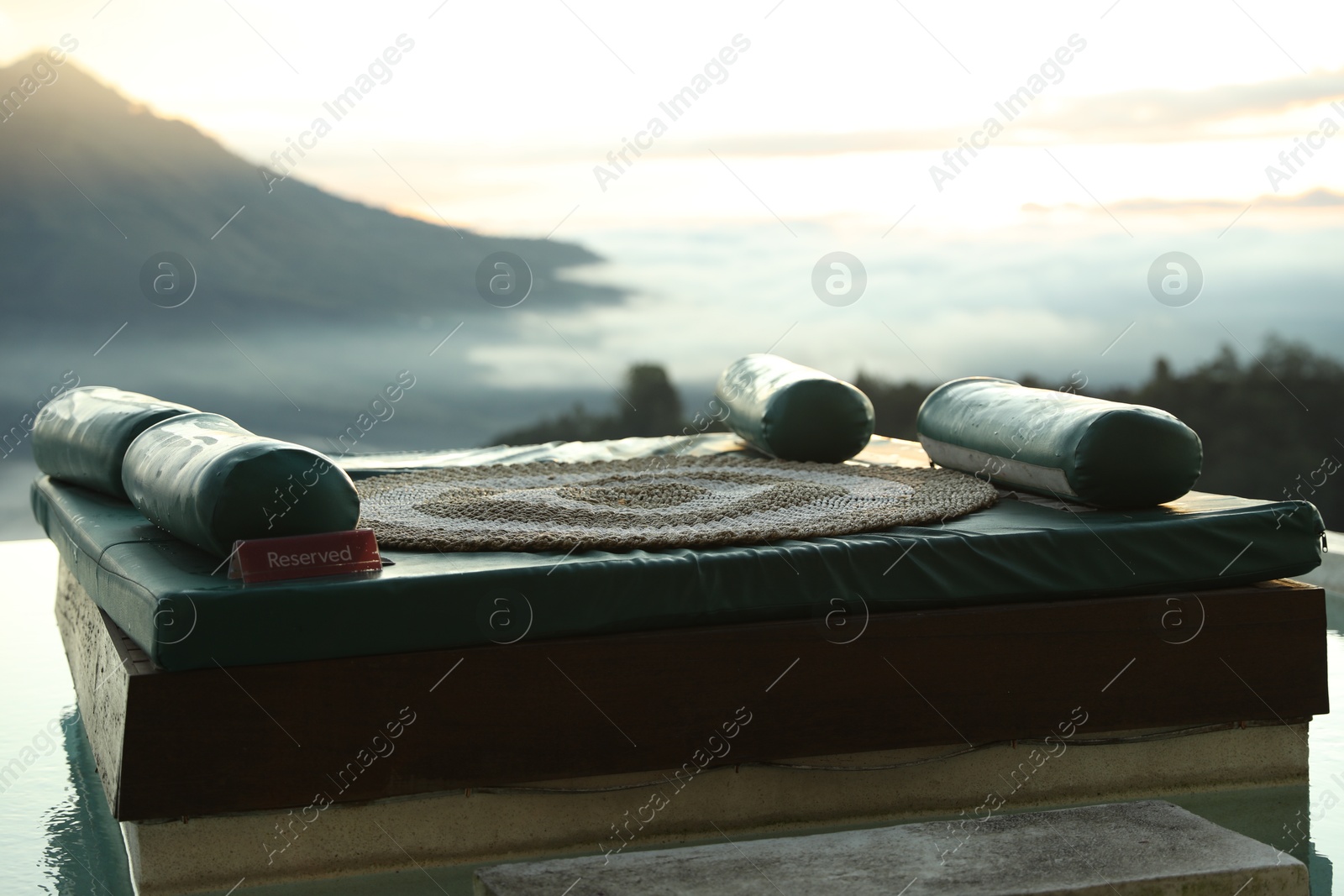Empty couch with picturesque view of mountains Photo of Empty couch with picturesque view of mountains