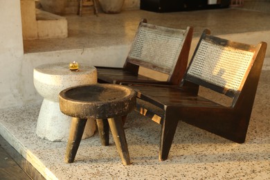 Photo of Empty wooden chairs and coffee tables outdoors