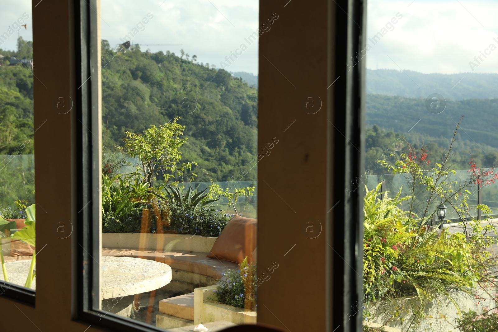 View through window on backyard and beautiful mountains Photo of View through window on backyard and beautiful mountains