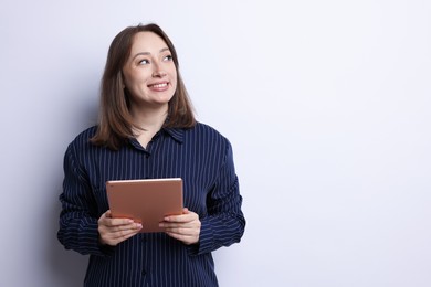 Photo of Woman with modern tablet on white background, space for text