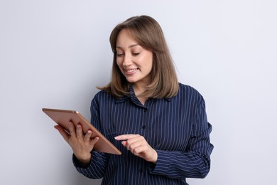 Photo of Woman with modern tablet on white background
