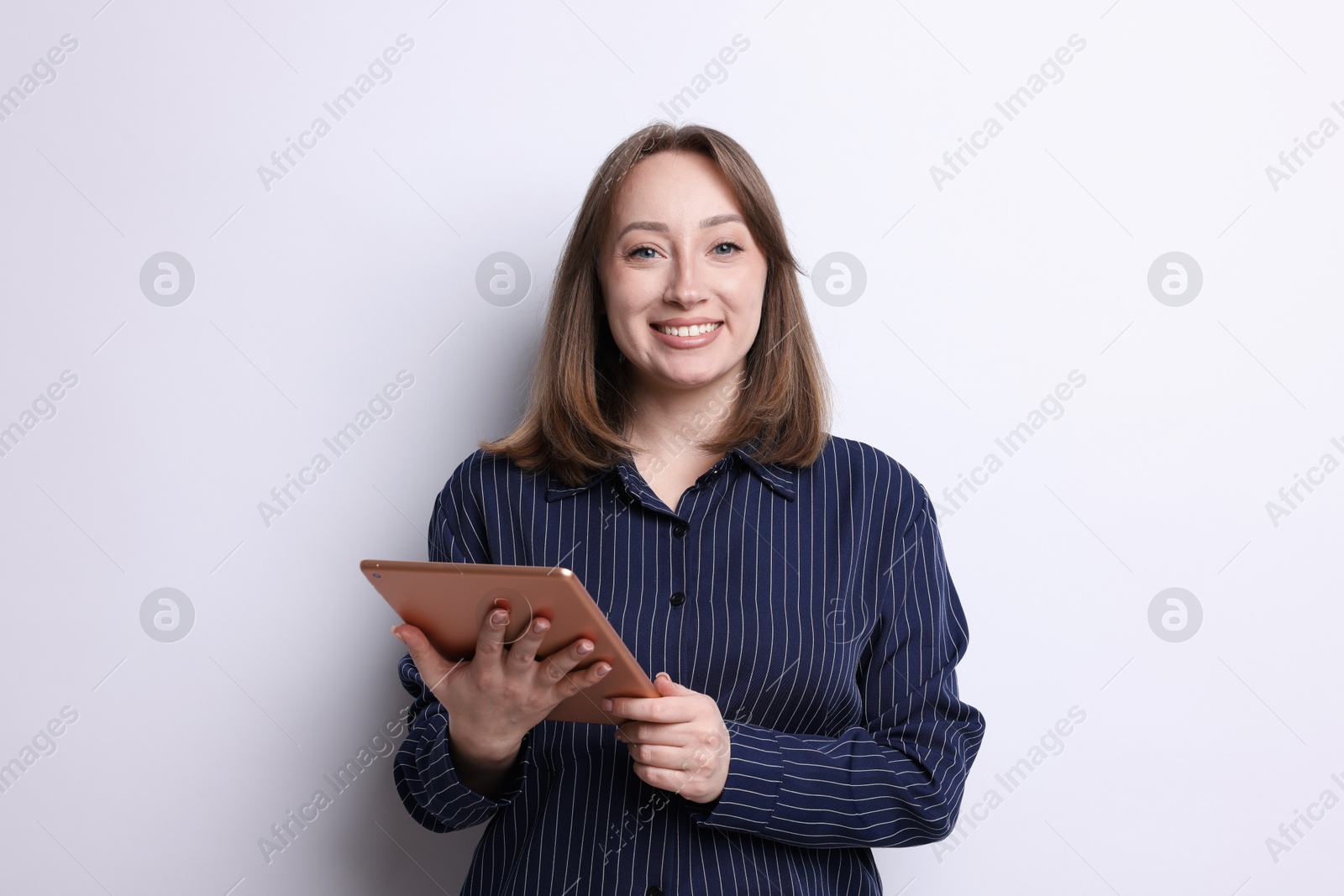 Woman with modern tablet on white background Photo of Woman with modern tablet on white background