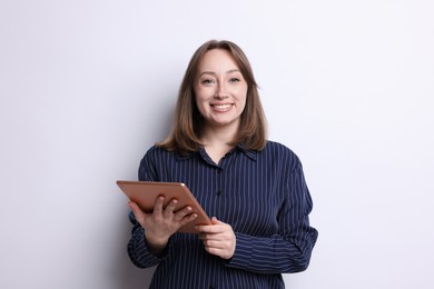 Photo of Woman with modern tablet on white background