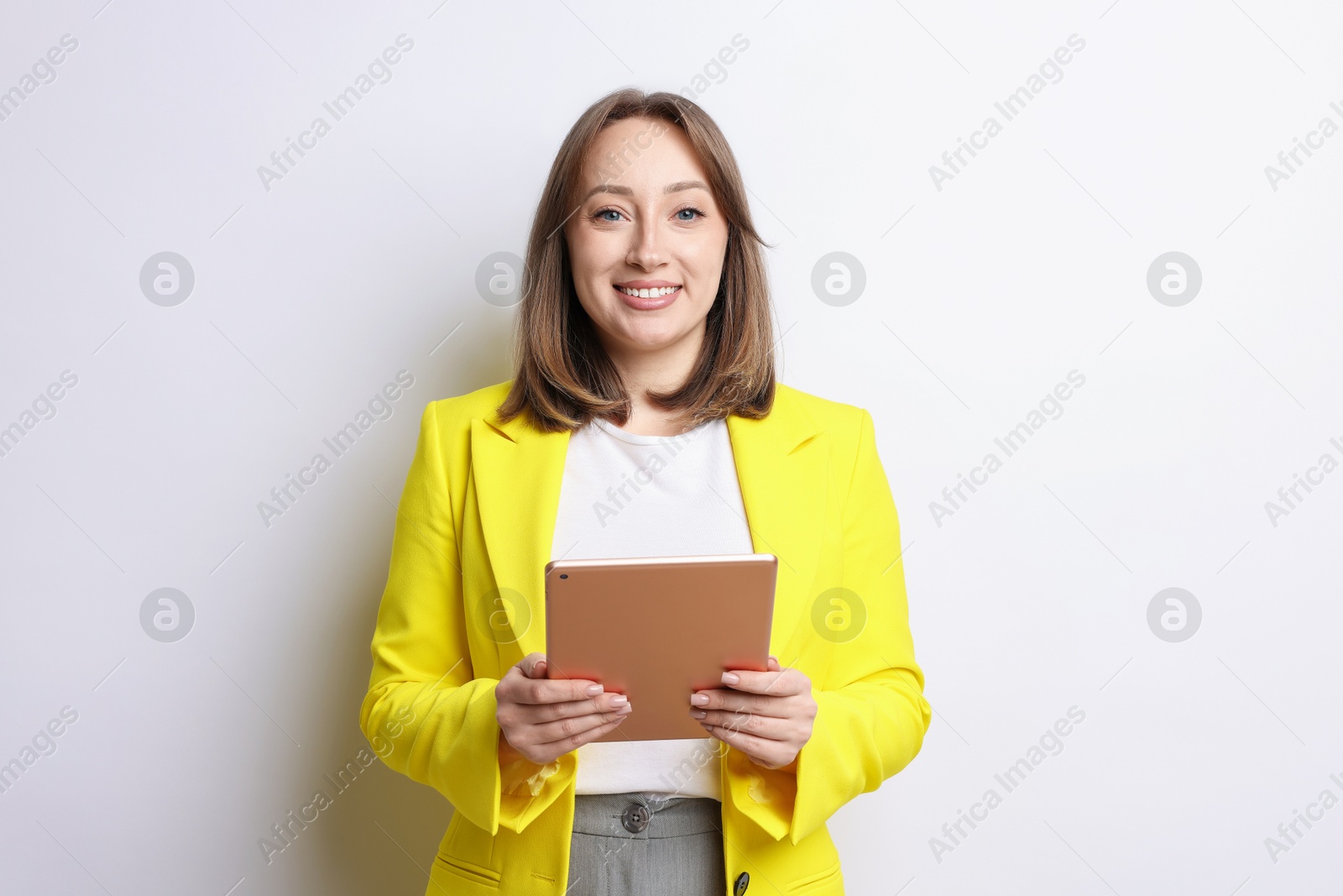 Woman with modern tablet on white background Photo of Woman with modern tablet on white background