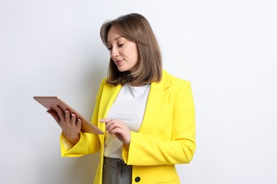 Photo of Woman with modern tablet on white background