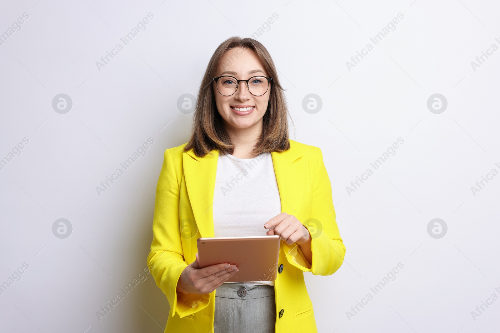 Woman with modern tablet on white background Photo of Woman with modern tablet on white background