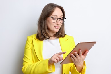 Photo of Woman with modern tablet on white background