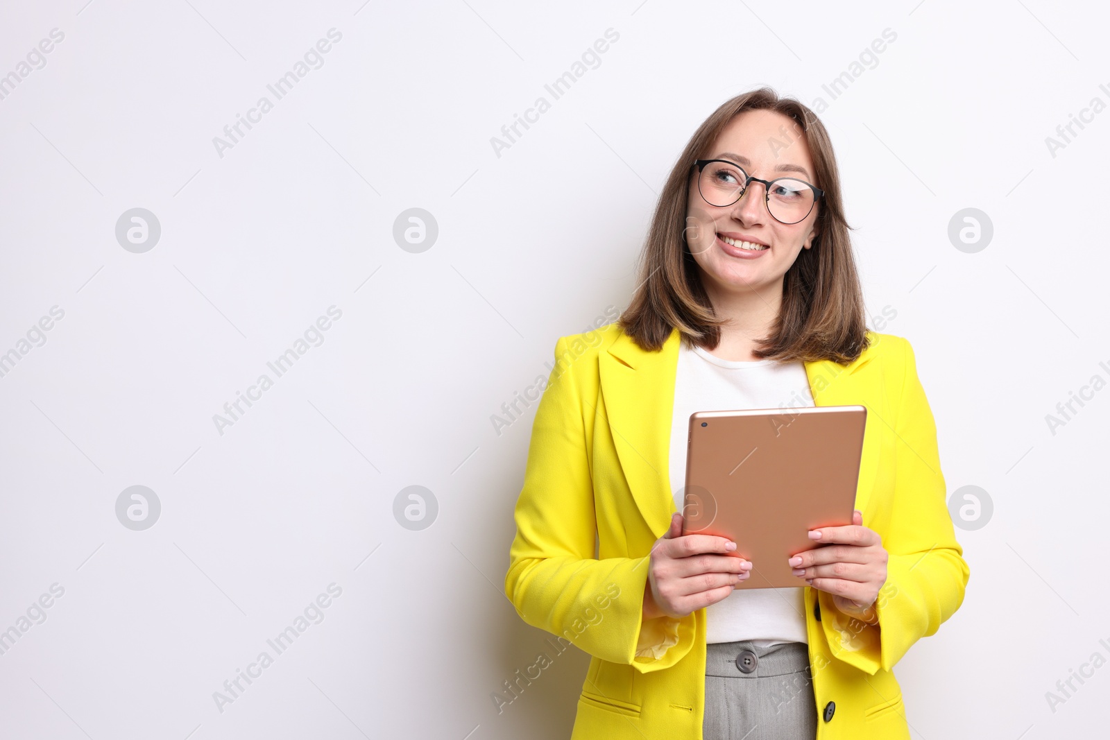 Woman with modern tablet on white background, space for text Photo of Woman with modern tablet on white background, space for text