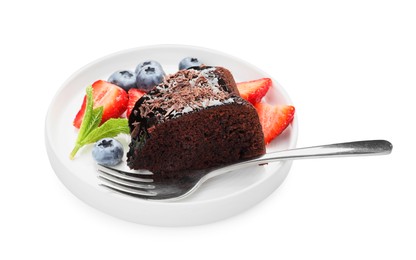 Photo of Piece of delicious chocolate bundt cake with strawberries, mint and blueberries isolated on white