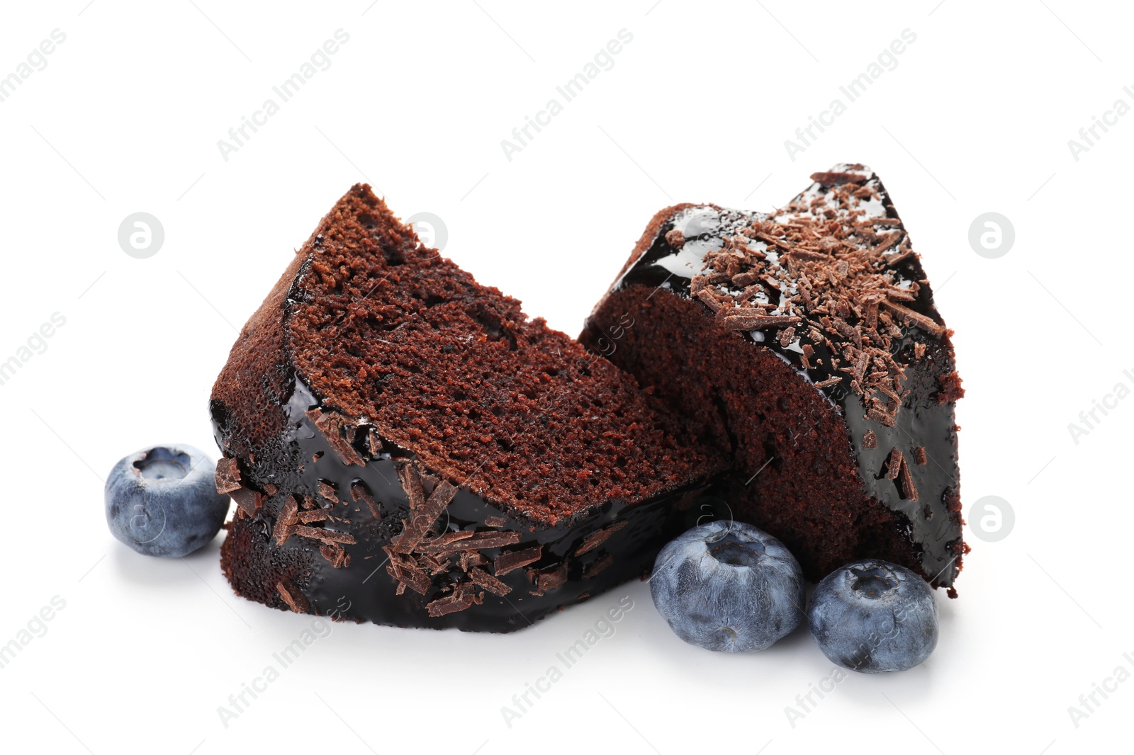 Pieces of delicious chocolate bundt cake and blueberries isolated on white Photo of Pieces of delicious chocolate bundt cake and blueberries isolated on white