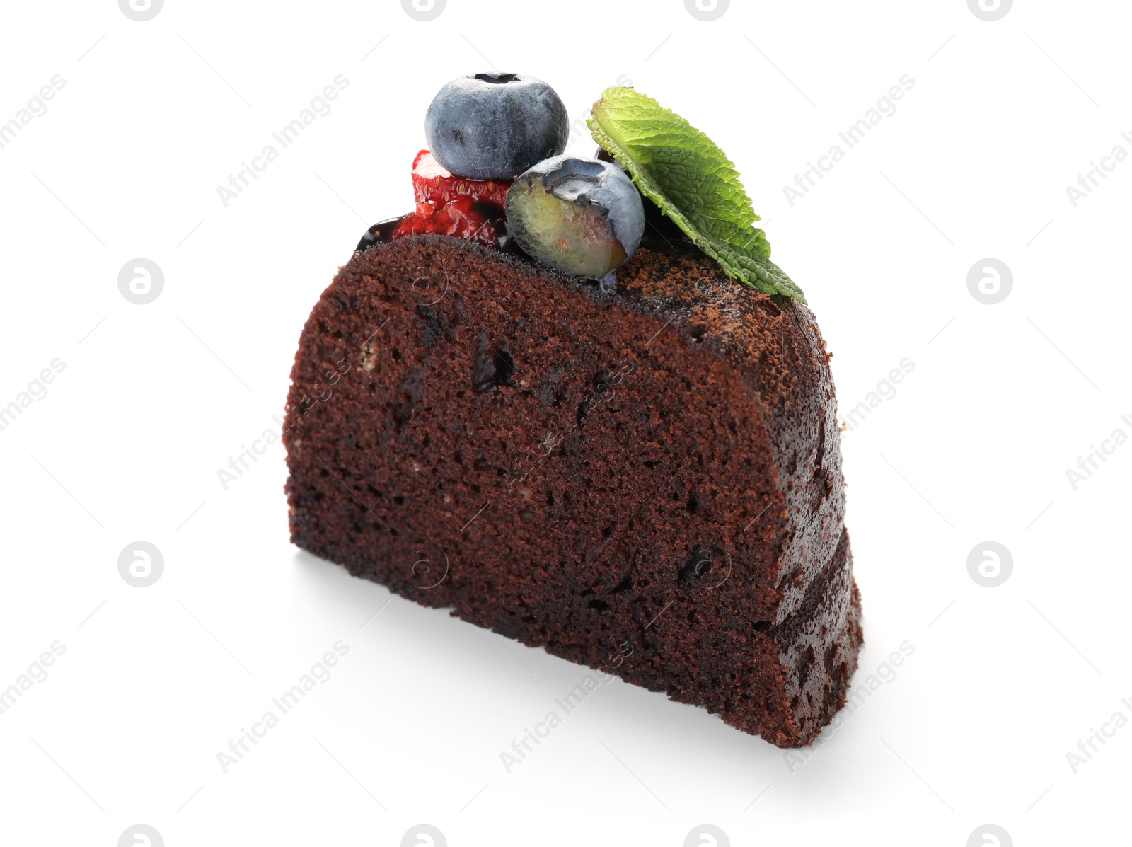 Piece of delicious chocolate bundt cake with mint and blueberries isolated on white Photo of Piece of delicious chocolate bundt cake with mint and blueberries isolated on white