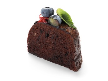 Photo of Piece of delicious chocolate bundt cake with mint and blueberries isolated on white