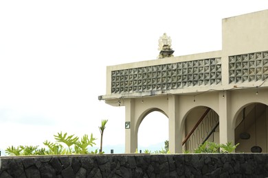 Photo of View of old station building and plants. Space for text