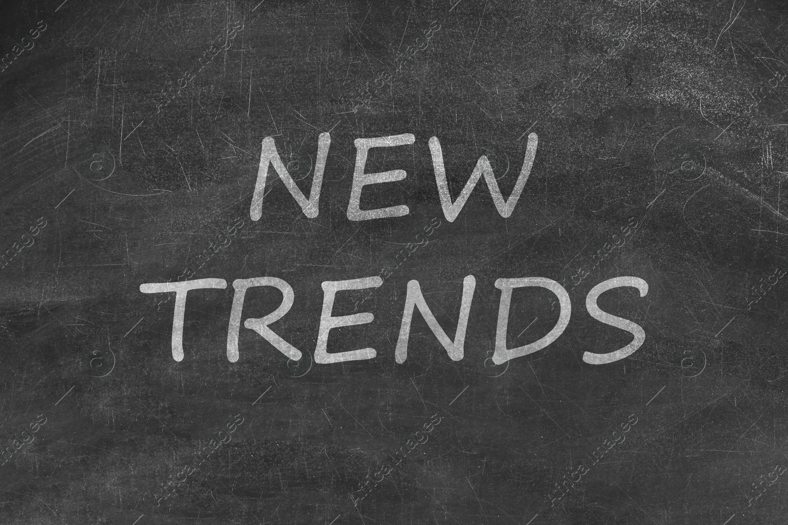 New Trends words written on black chalkboard Image of New Trends words written on black chalkboard