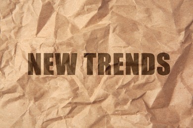 Image of New Trends. Words on crumpled sheet of paper