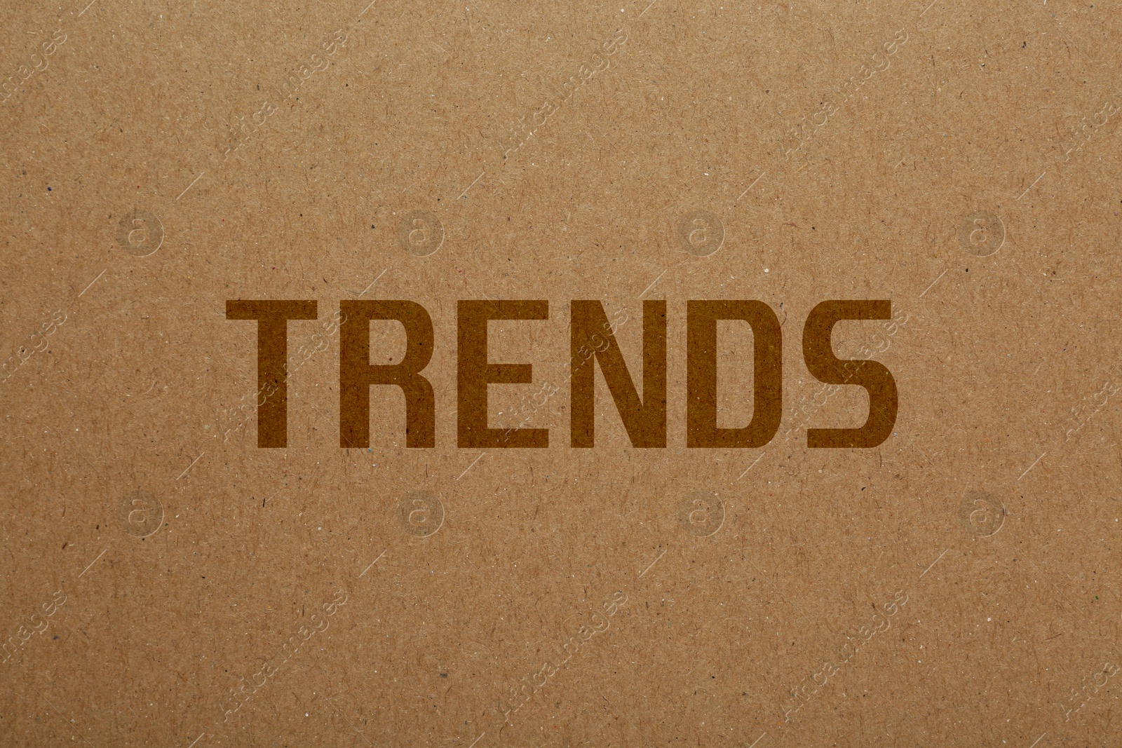 Image of Trends. Word on pale brown textured background