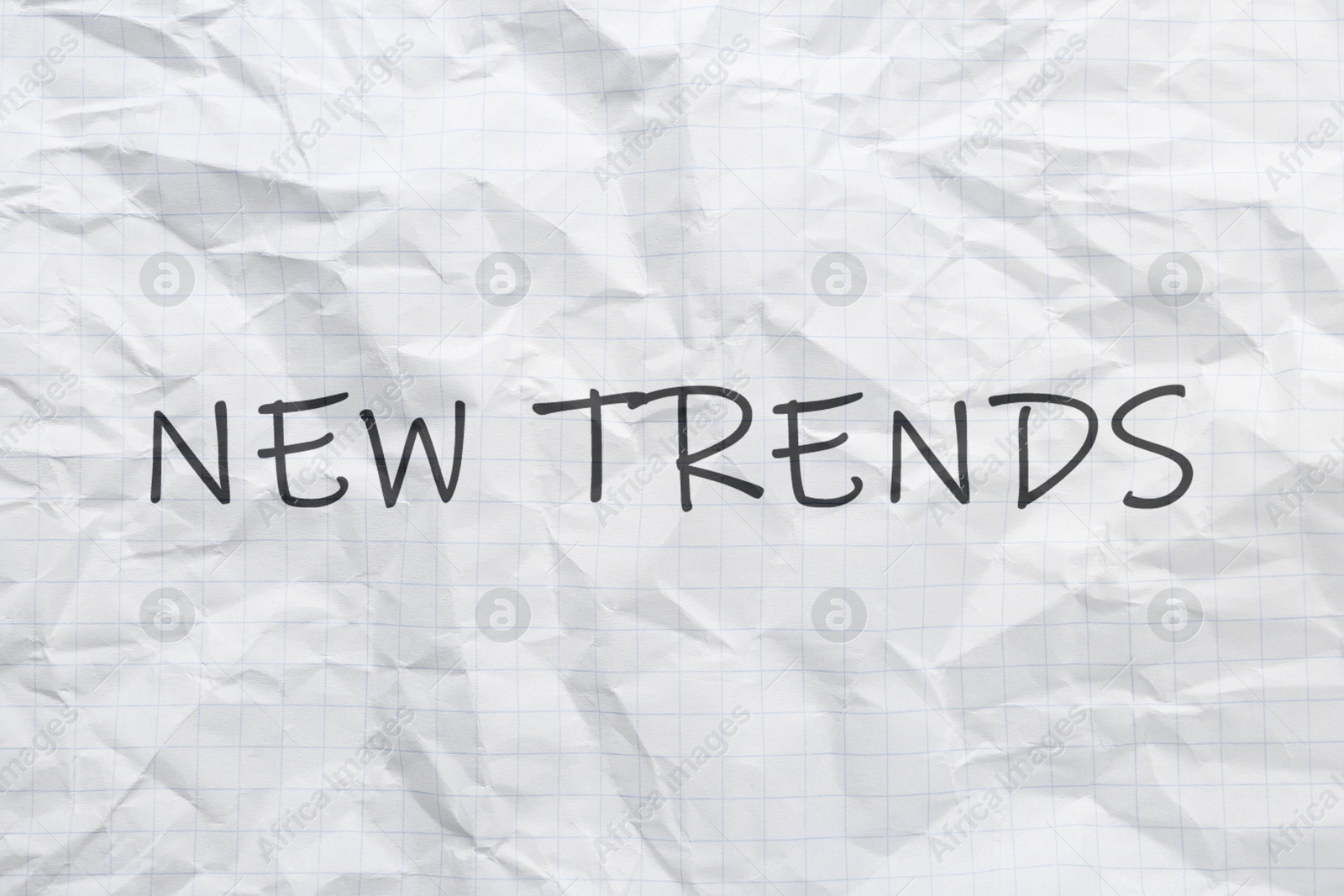 New Trends. Words on crumpled sheet of paper Image of New Trends. Words on crumpled sheet of paper