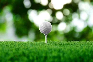 Image of Golf ball on green grass outdoors, closeup