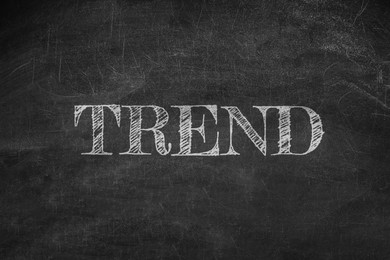 Image of Trend concept. White word on black chalkboard
