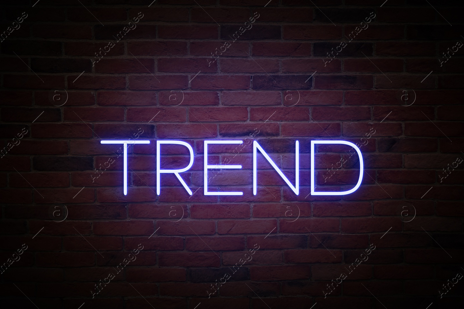 Neon sign with word Trend on brick wall Image of Neon sign with word Trend on brick wall