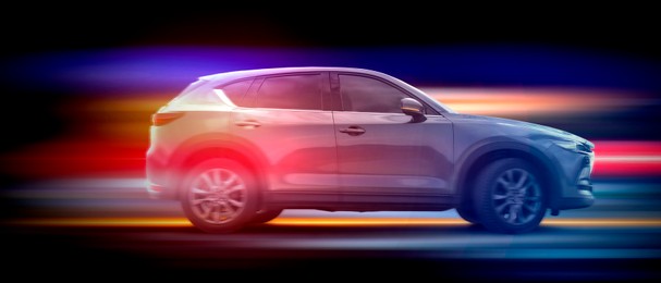 Image of Car and speed light trails on black background, motion blur effect. Banner design