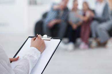Photo of Family psychologist working in office, selective focus