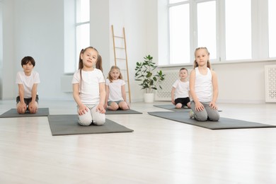 Photo of Group of children on yoga mats in class