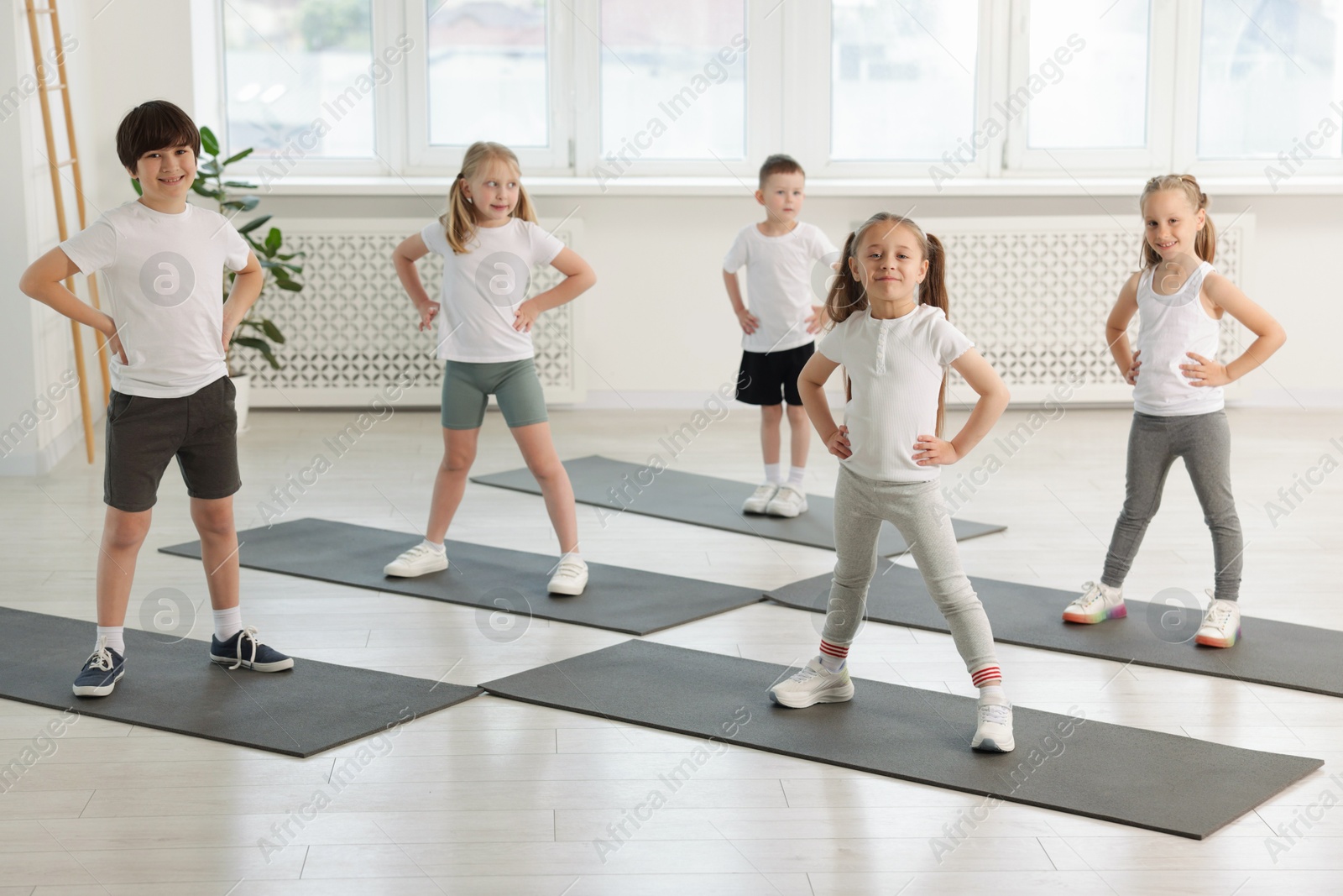 Photo of Group of children on yoga mats in class