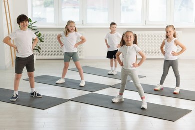 Photo of Group of children on yoga mats in class