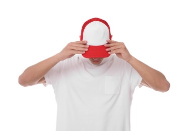 Photo of Young man wearing stylish baseball hat on white background