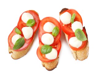 Photo of Tasty sandwiches with mozzarella cheese, tomatoes and basil on white background, top view