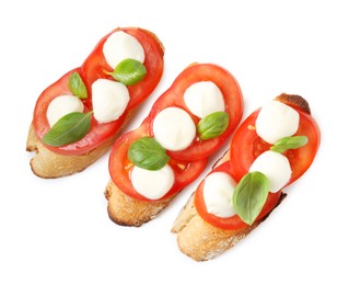 Photo of Tasty sandwiches with mozzarella cheese, tomatoes and basil on white background, top view